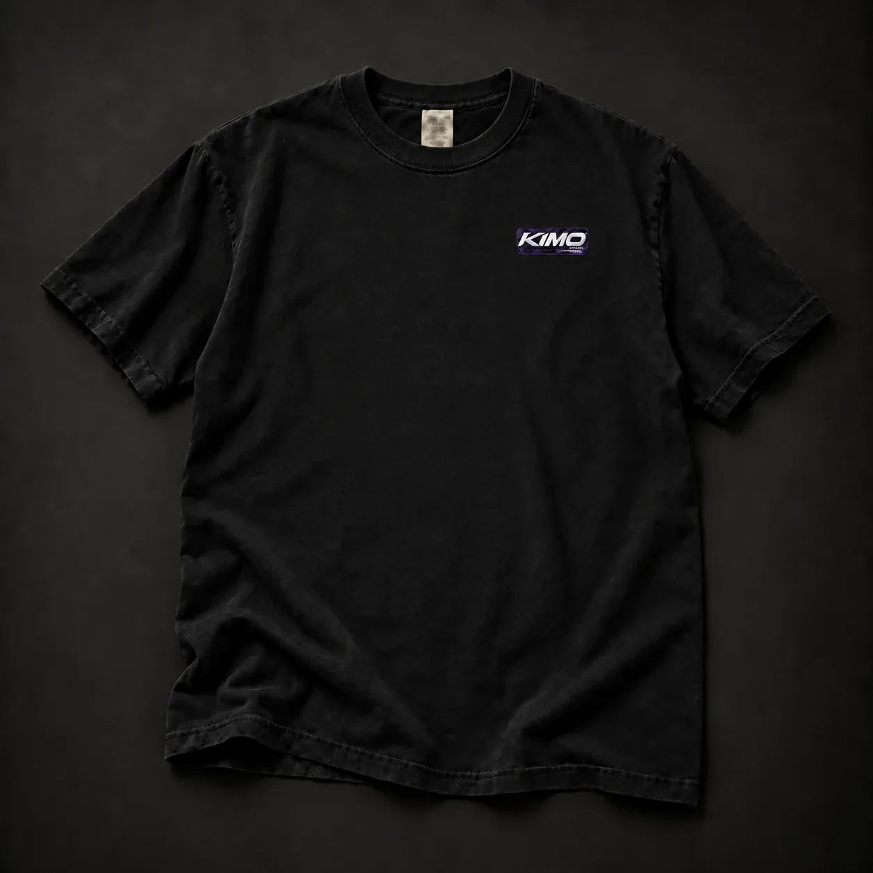 Front of the shirt with the small purple-and-white KIMO Apparel logo at the left chest
